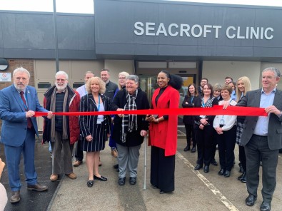 Pat Oxley, first patient at Seacroft Clinic cutting the ribbon at the reopening of the clinic alongside Councillor Abigail Katung, Councillor David Jenkins and Leeds Community Healthcare’s Sam Prince, Executive Director of Operations and Bryan Machin, Exe