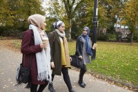 Young muslim women walking in park