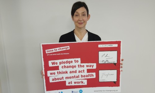 Thea Stein holding time to change pledge sign