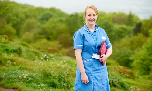 NHS Nurse stood in field